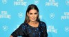 Vanessa Claudio posando con un elegante atuendo | Timothy Hiatt/Getty Images