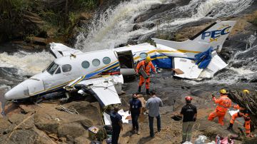 CARATINGA, BRAZIL - NOVEMBER 06: A military firefighter removes a guitar case from the crashed plane which carried singer Marília Mendonça and 4 passengers on November 6, 2021 in Caratinga, Brazil. Mendonça left the city of Goiânia on November 5 in a small aircraft (Beech Aircraft model) that crashed in rural Caratinga where the singer and 4 other people died. Marília had a show scheduled in Minas Gerais. The causes of the accident remain unknown; the singer was 26 years old. (Photo by Pedro Vilela / Getty Images)