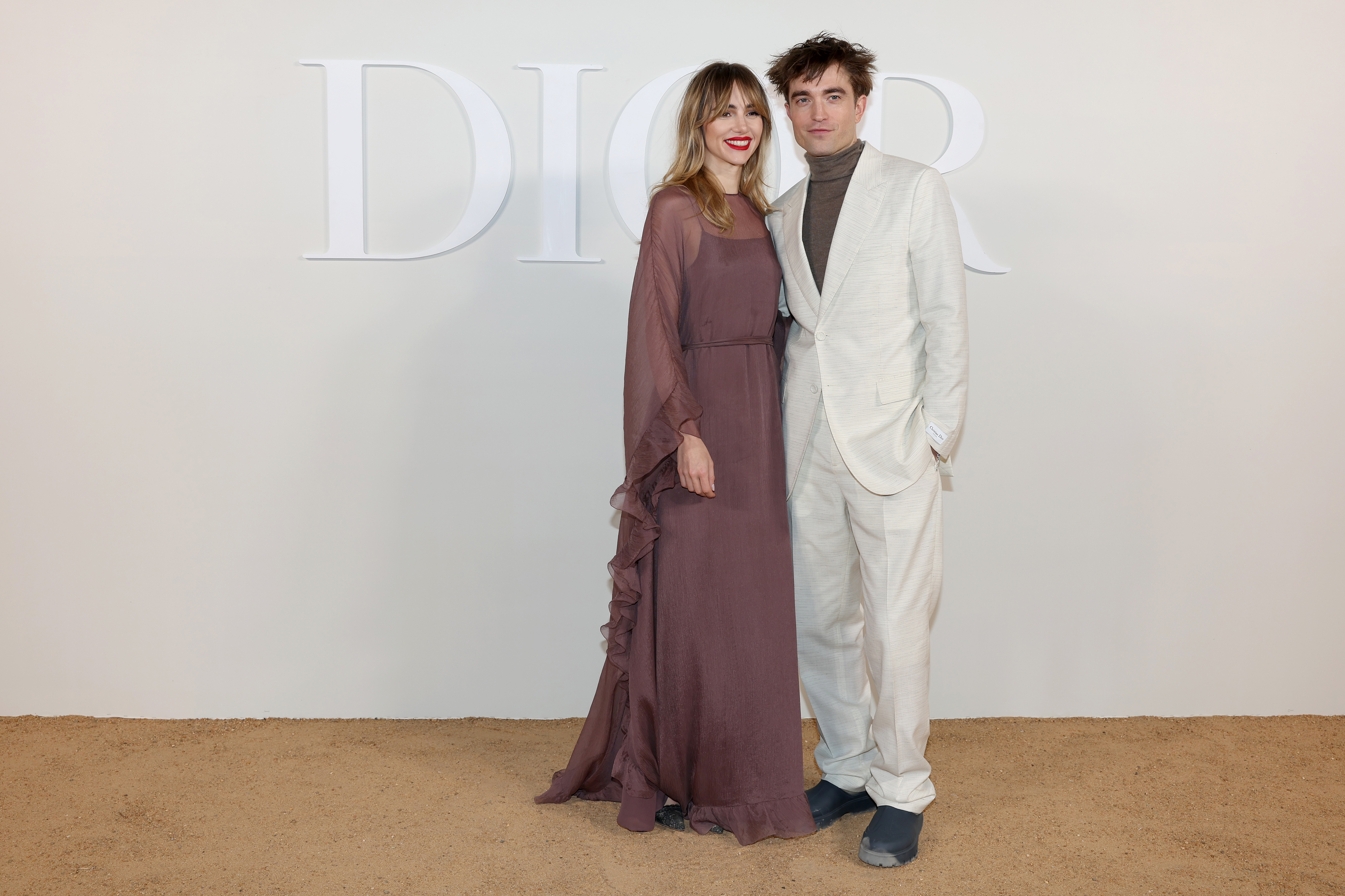 CAIRO, EGYPT - DECEMBER 03: Suki Waterhouse and Robert Pattinson attend the Dior Fall 2023 Menswear Collection on December 03, 2022 in Cairo, Egypt. (Photo by Pascal Le Segretain/Getty Images For Christian Dior)