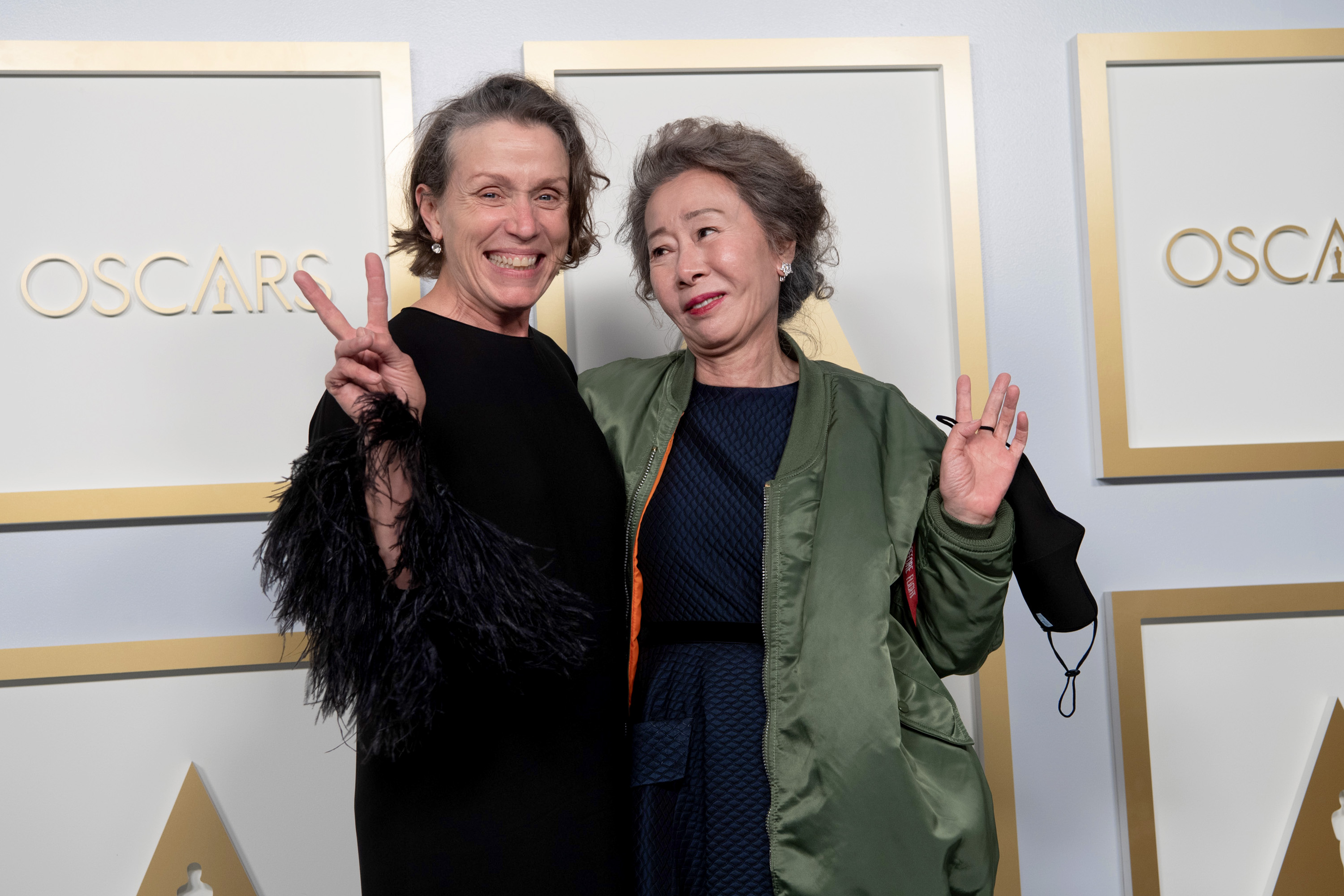 LOS ANGELES, CALIFORNIA – APRIL 25: (EDITORIAL USE ONLY) In this handout photo provided by A.M.P.A.S., (L-R) Frances McDormand and Chloe Zhao, winners of Best Picture for "Nomadland," pose in the press room during the 93rd Annual Academy Awards at Union Station on April 25, 2021 in Los Angeles, California. (Photo by Matt Petit/A.M.P.A.S. via Getty Images)