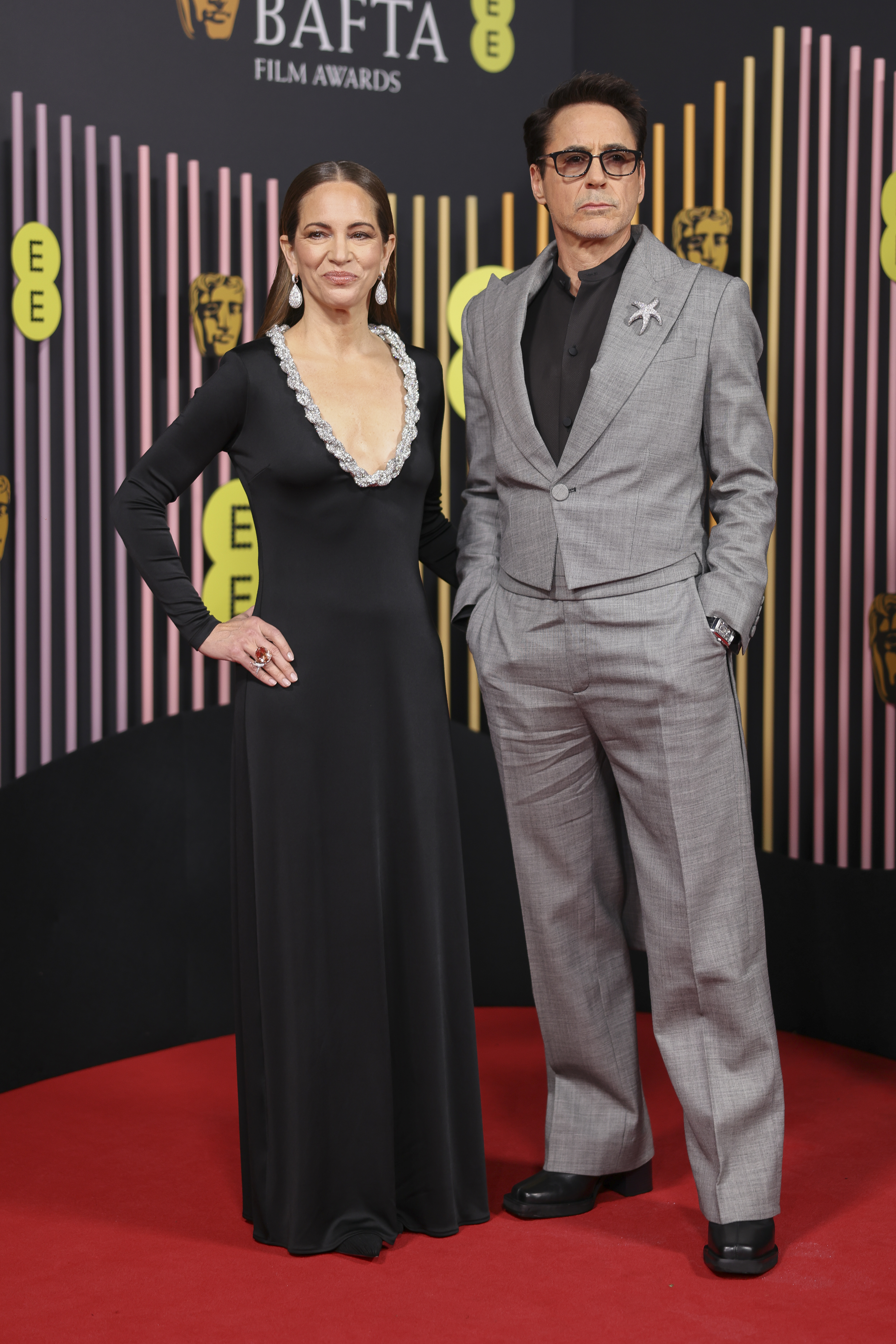 Susan Downey, left, and Robert Downey Jr. pose for photographers upon arrival at the 77th British Academy Film Awards, BAFTA's, in London, Sunday, Feb. 18, 2024. (Photo by Vianney Le Caer/Invision/AP)