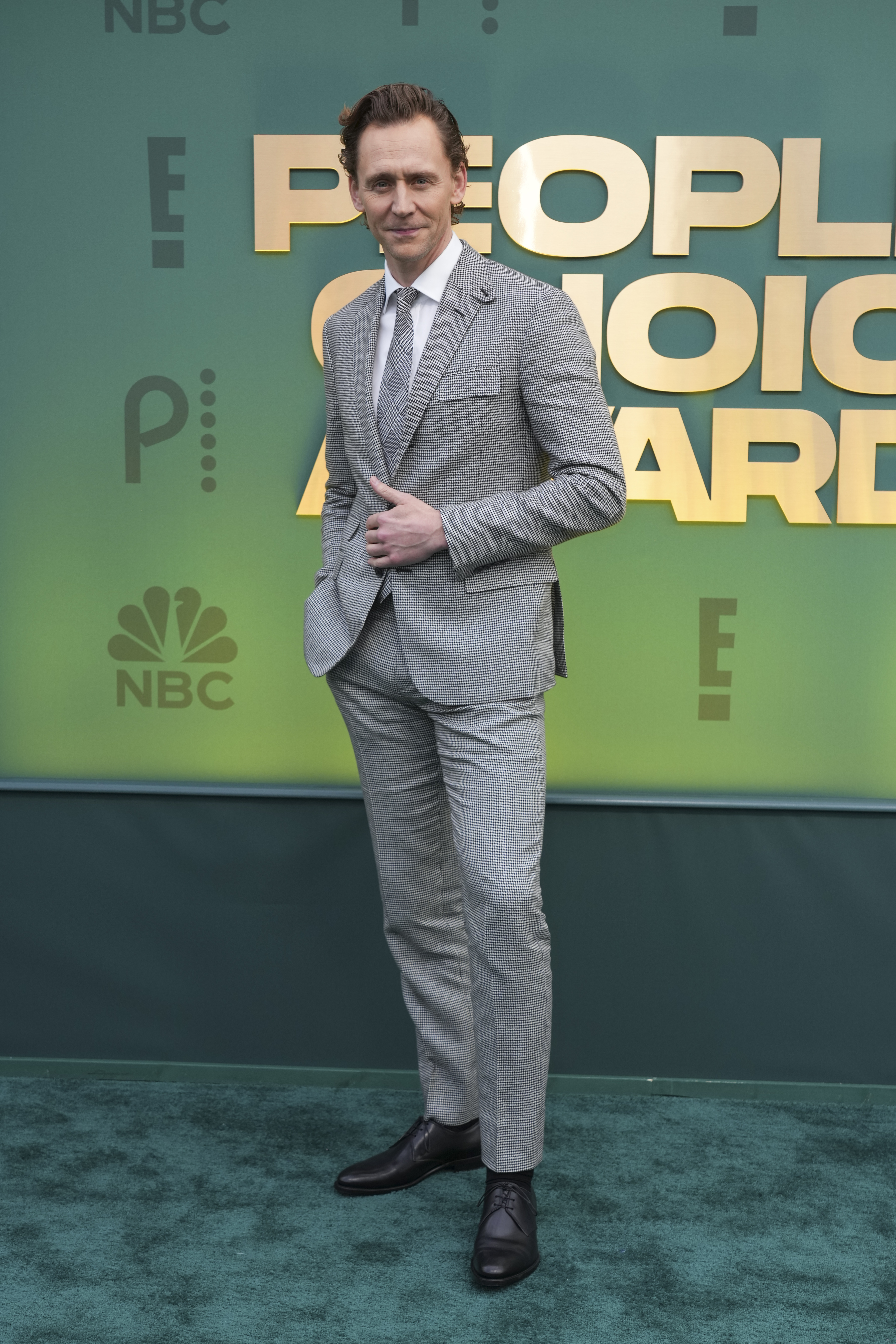 Tom Hiddleston arrives at the People's Choice Awards on Sunday, Feb. 18, 2024, at the Barker Hangar in Santa Monica, Calif. (Photo by Jordan Strauss/Invision/AP)