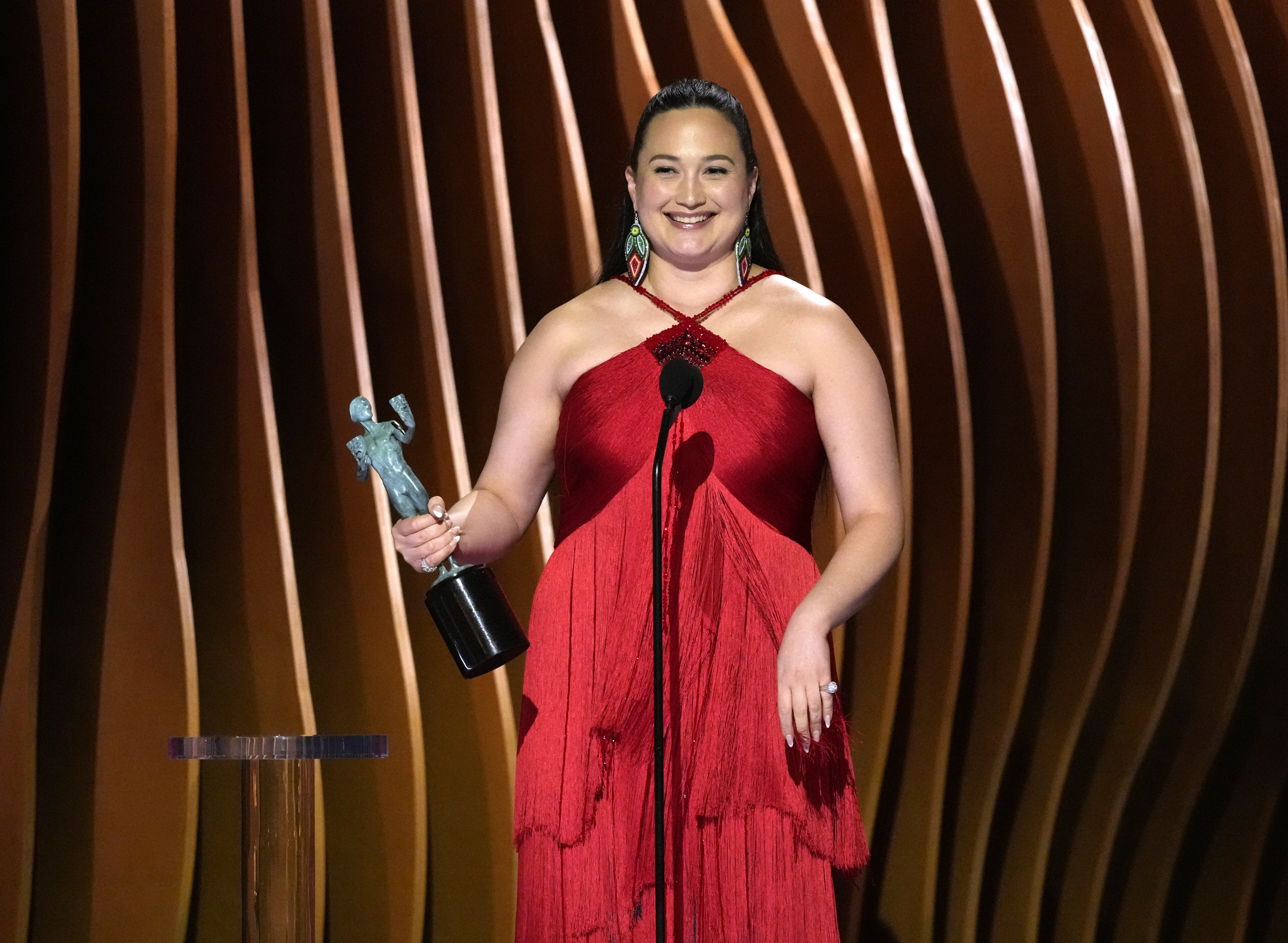 Lily Gladstone accepts the award for outstanding performance by a female actor in a leading role for "Killers of the Flower Moon" during the 30th annual Screen Actors Guild Awards on Saturday, Feb. 24, 2024, at the Shrine Auditorium in Los Angeles. (AP Photo/Chris Pizzello)